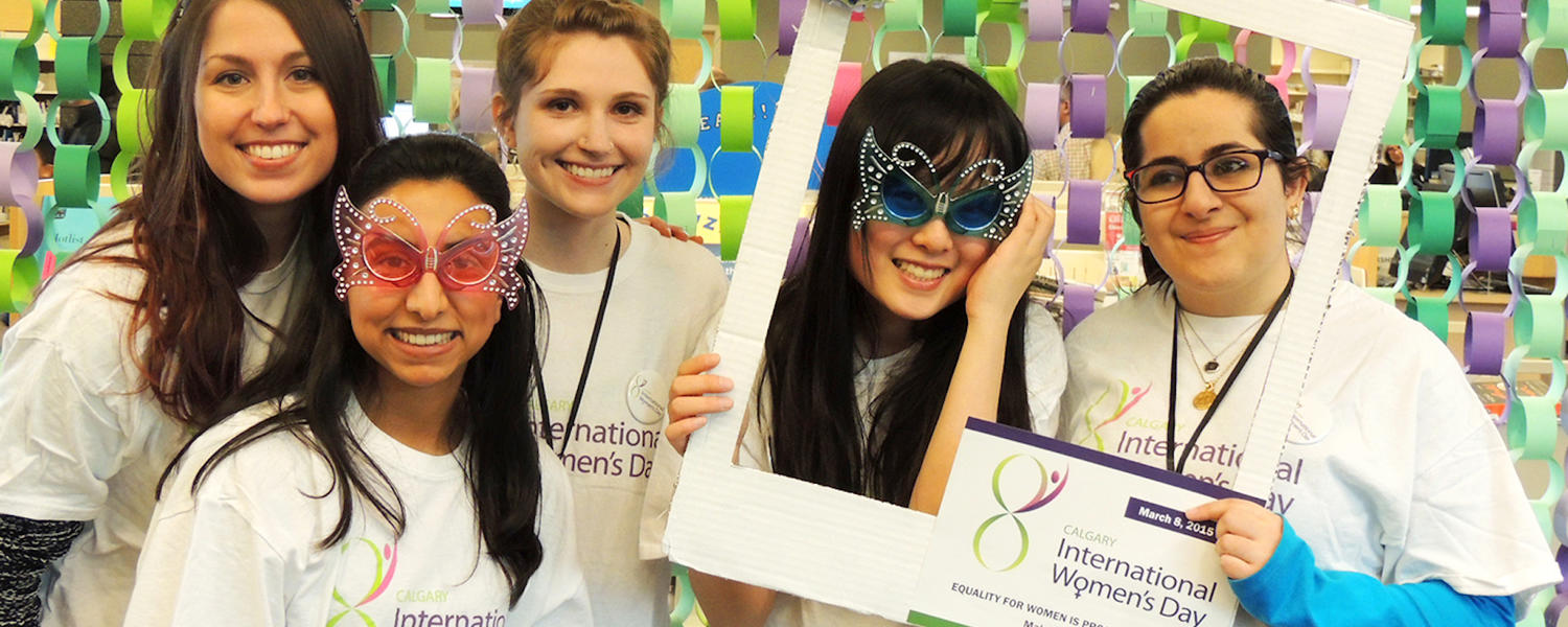 women having fun at a photobooth