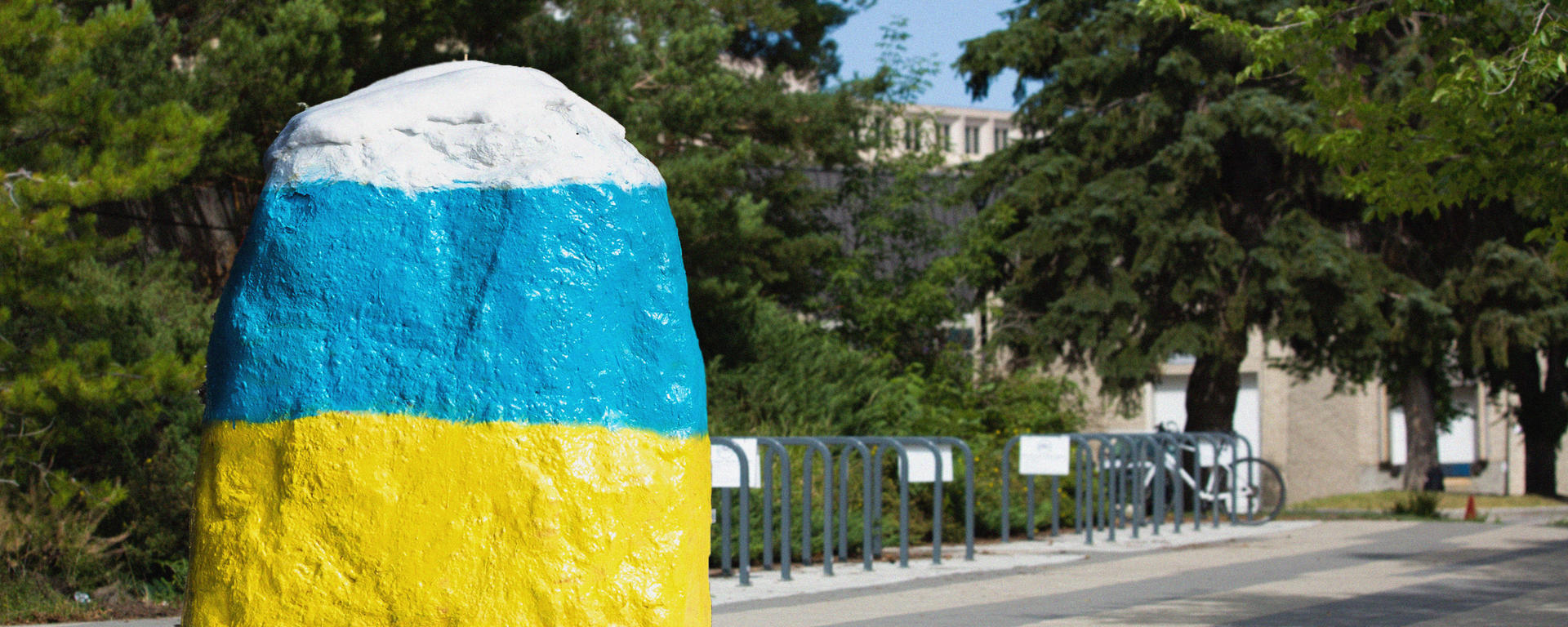 UCalgary rock painted in Ukraine flag colours