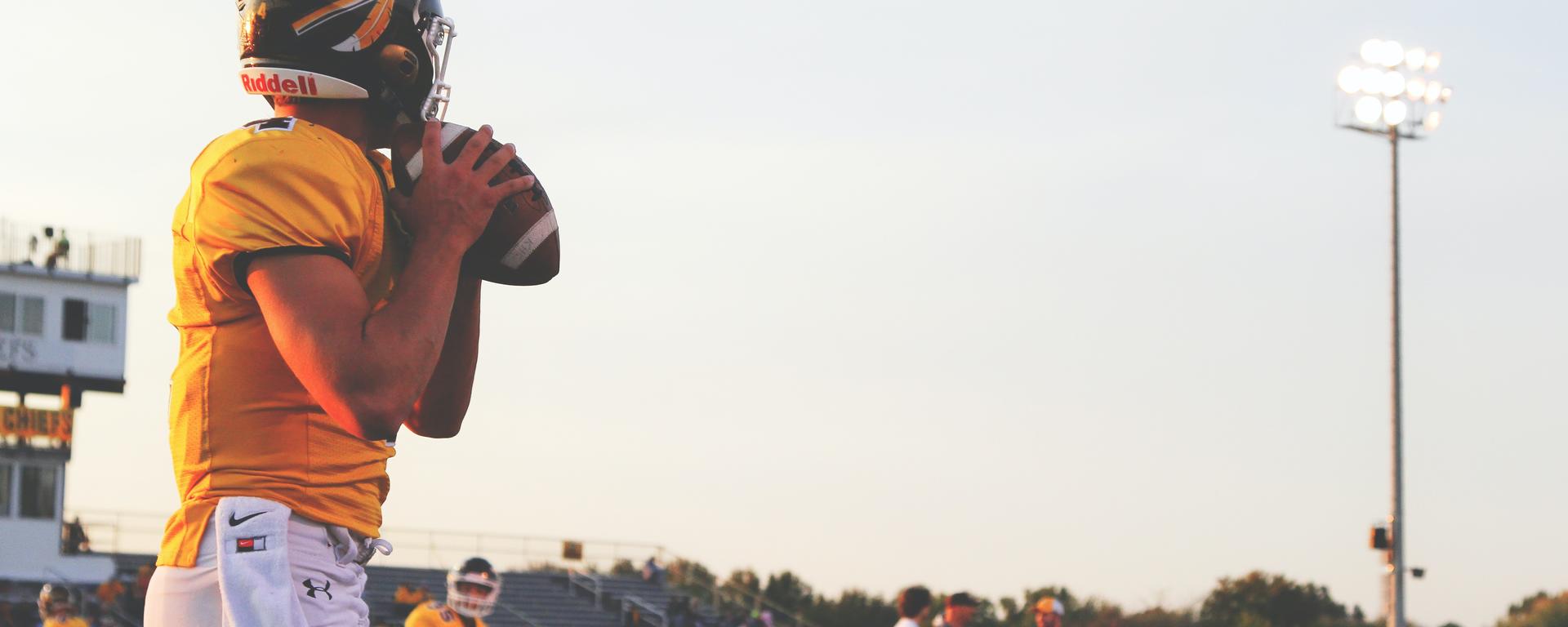 Youth football player getting ready to throw football