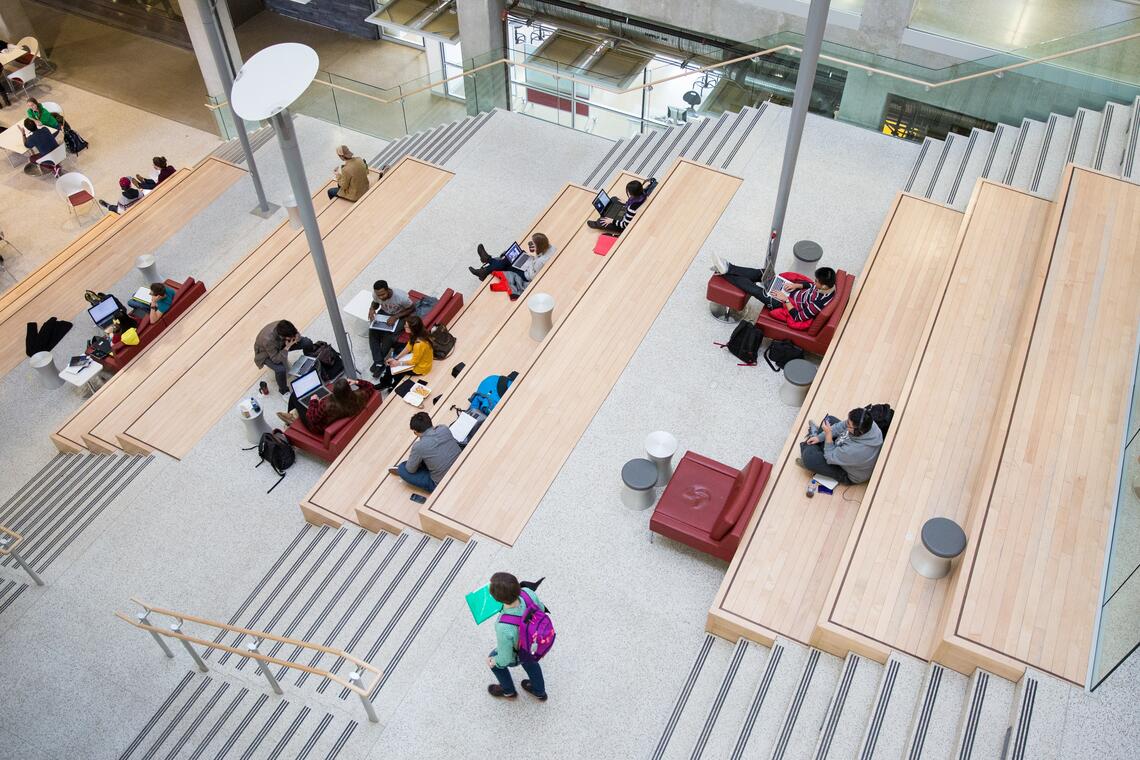 students sitting in EEEL on the staircase