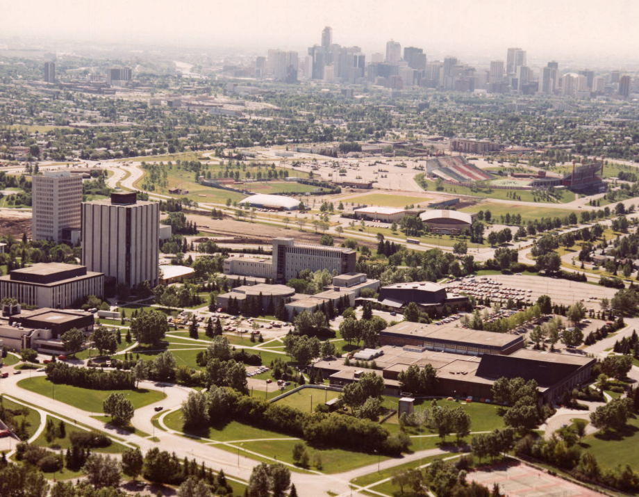 Image of an aerial view of the University of Calgary campus looking south towards downtown Calgary  with Physical Education in the foreground and MacEwan Hall in the foreground.