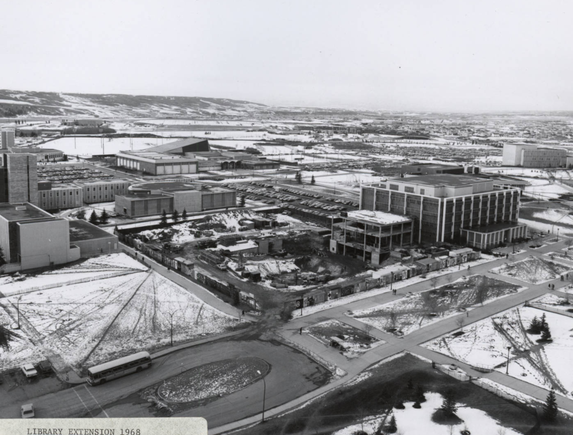 Image of construction work in the Library Extension foundation and on the Library Extension link as seen from the roof of the Education Tower looking northwest.