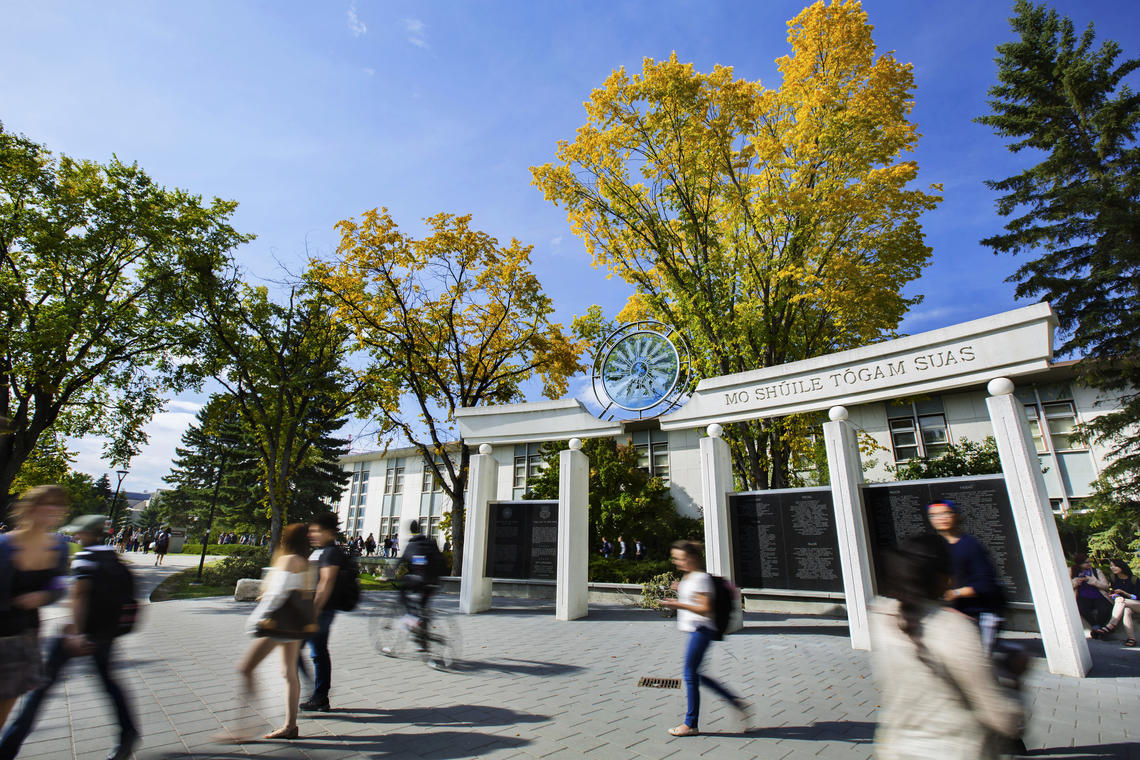 Students walk around UCalgary main campus