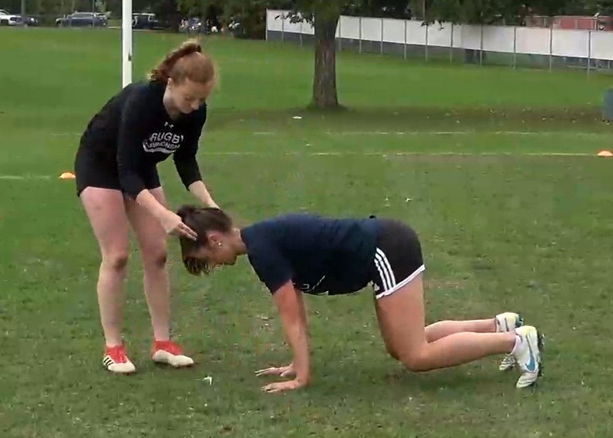 Athletes performing bear crawl bobblehead exercise