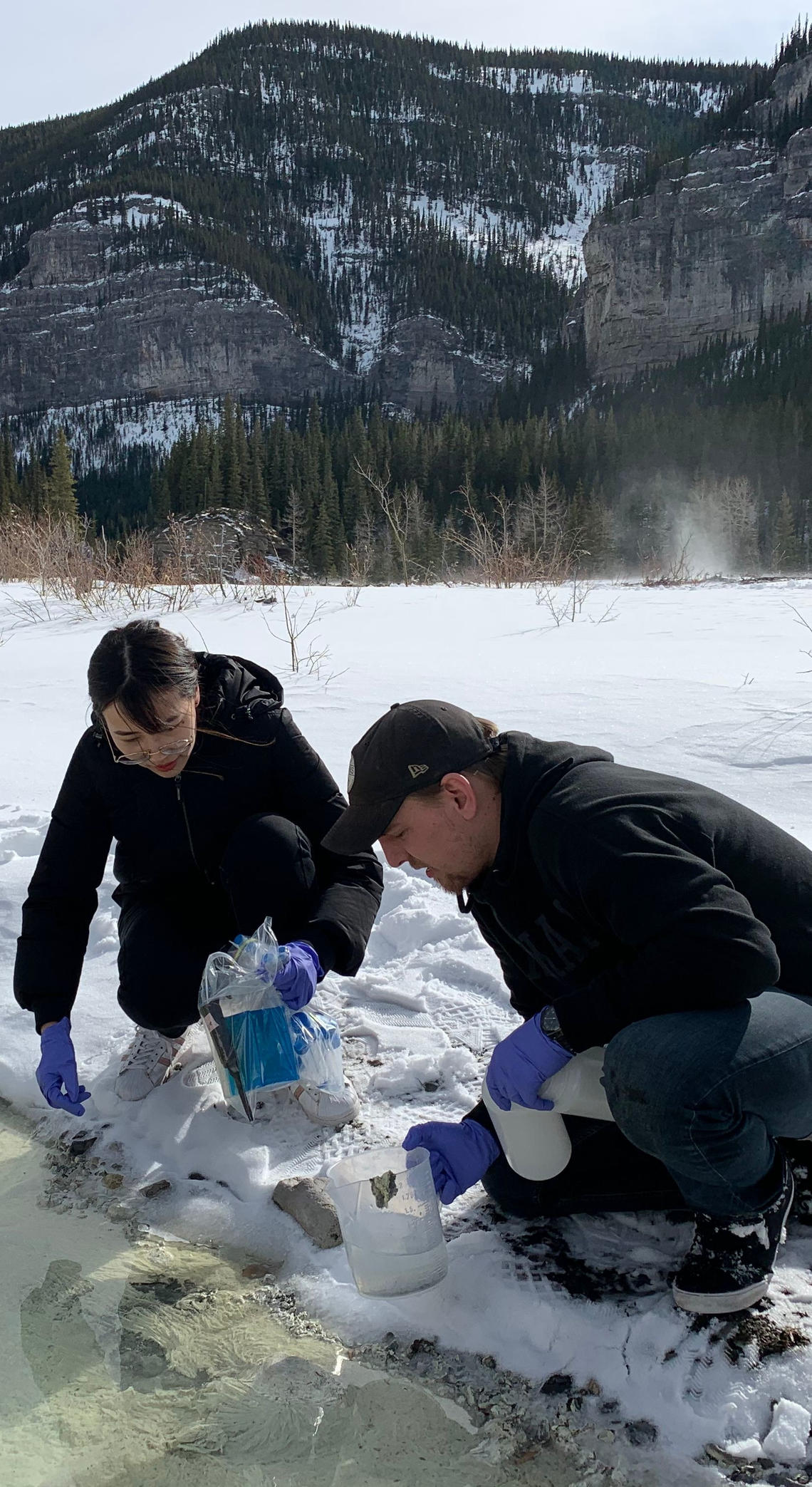 Shengjie Li and Damon Mosier sampling a hot spring near Bragg Creek (AB) 