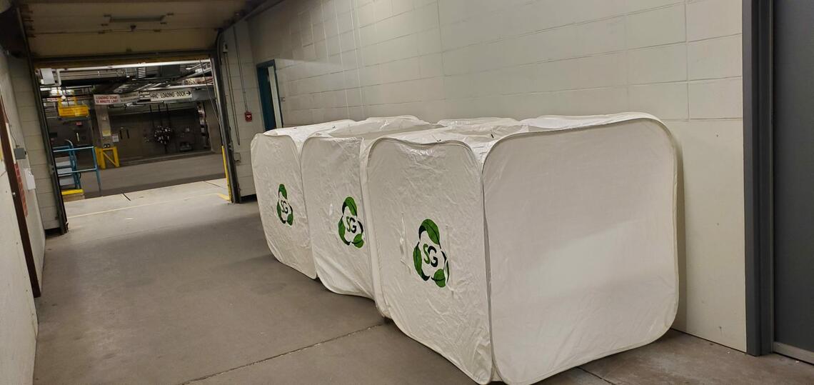 Recycling bins located at Foothills campus loading dock. Three bins in a row.