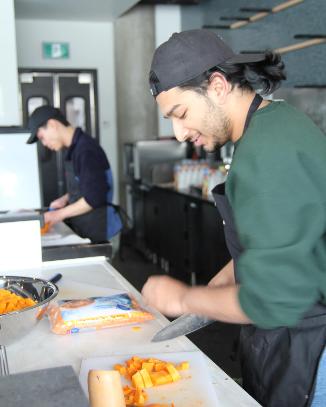 Student volunteers in a kitchen