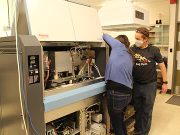 Kerri Miller and Mike Wieser performing maintenance on the Neptune.