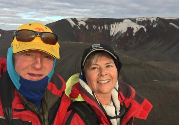 selfie of a man and woman on a mountain