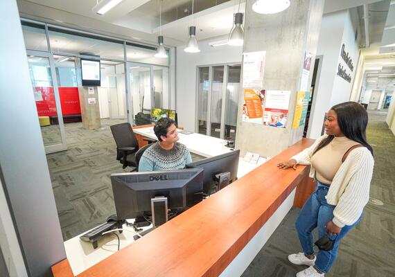 A student checks in at the SSC front desk