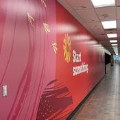 Large, long mural with Start something graphics