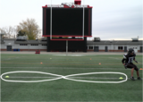 Football athlete performing figure 8 jogging