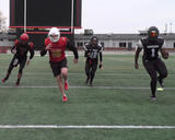 Football athletes performing hops