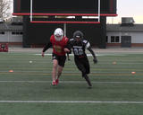 Football athletes performing shoulder-to-shoulder runs