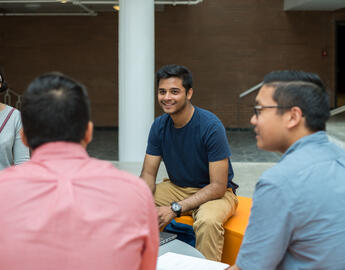 Students chatting in a small circle